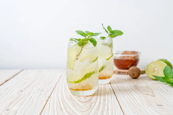 iced honey and lime soda with mint - refreshing drink