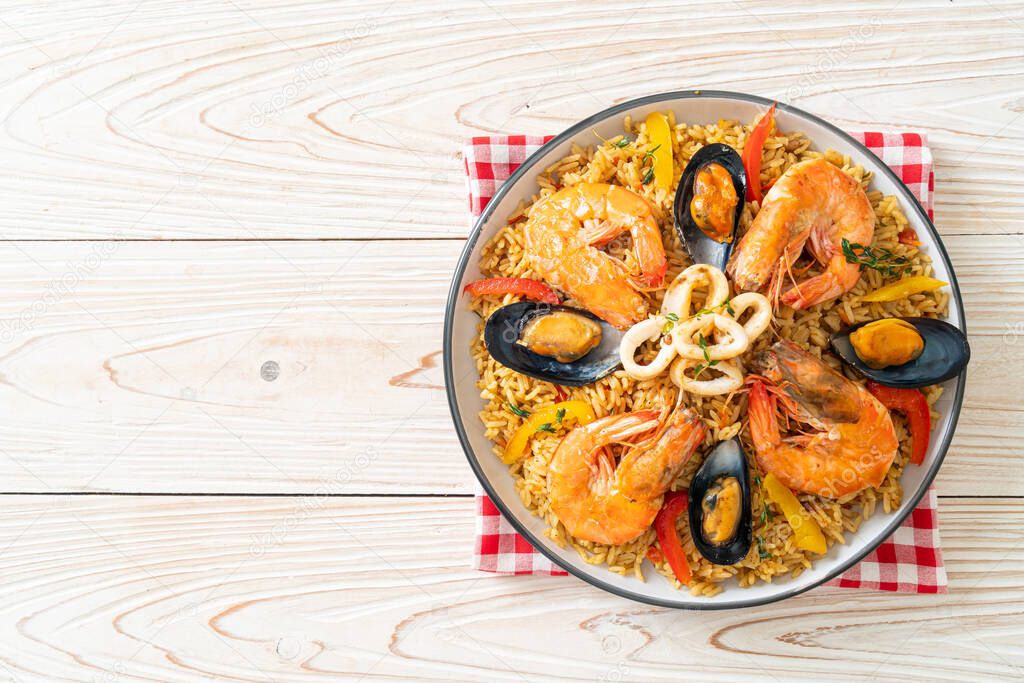 Seafood Paella with prawns, clams, mussels on saffron rice - Spanish food style