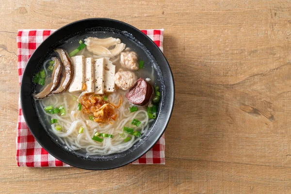 Vietnamese Rice Noodles Soup with Vietnamese Sausage served vegetables and crispy onion - Asian food style