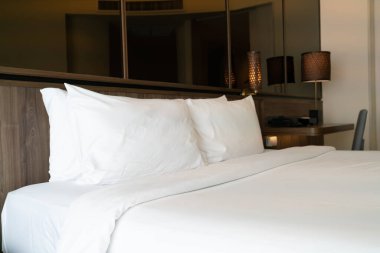 white pillows on bed decoration in luxury bedroom