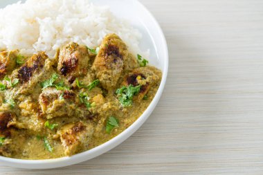 Afghani chicken in green curry or Hariyali tikka chicken hara masala with rice - Asian food style