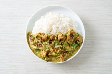 Afghani chicken in green curry or Hariyali tikka chicken hara masala with rice - Asian food style