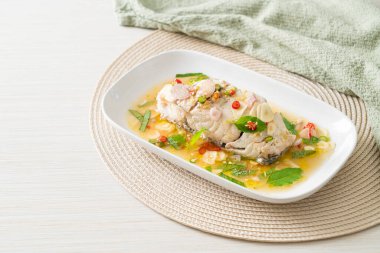 steamed sea bass fish fillet steak with herbs