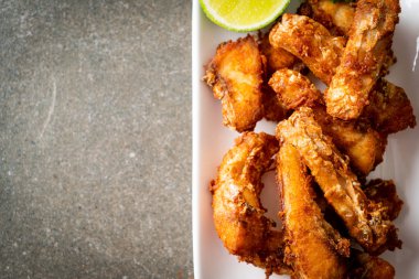 Fried Snapper Belly on white plate - Asian food style