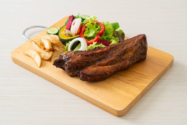 grill barbecue pork spare ribs with vegetables