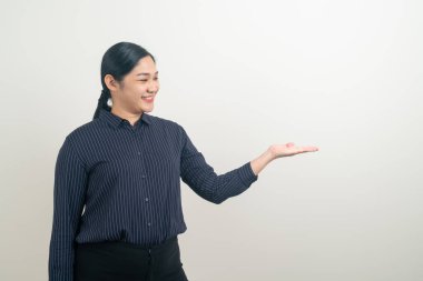 Asian woman with hand presenting on wall