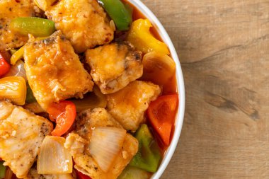 fish stew with tomato and pepper on plate