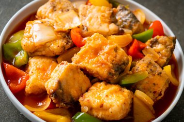 fish stew with tomato and pepper on plate