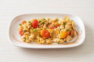 stir-fried tomatoes with egg on plate - healthy food style