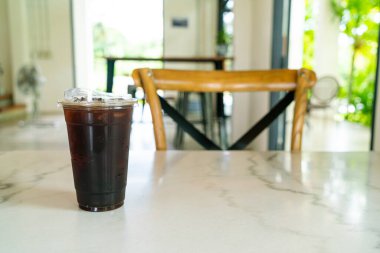 iced americano coffee or long black coffee glass in coffee shop cafe