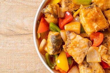 fish stew with tomato and pepper on plate