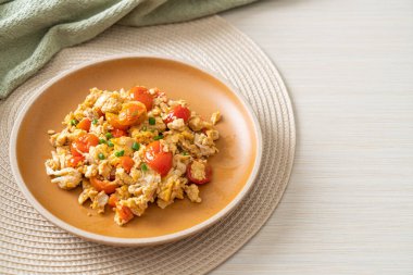 stir-fried tomatoes with egg on plate - healthy food style