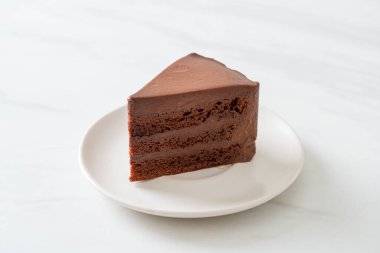 chocolate cake with soft chocolate layer on plate