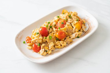 stir-fried tomatoes with egg on plate - healthy food style