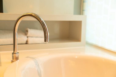close-up tap on bath tub in bathroom