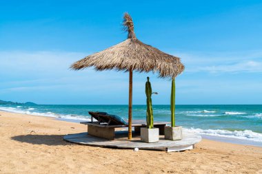 beach chair and umbrella with sea beach background - Holidays and vacation concept
