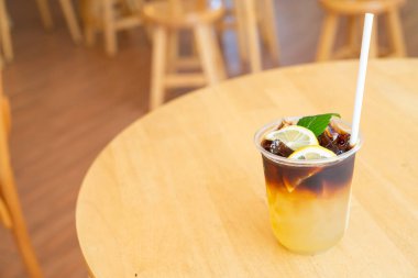 lemon with black coffee in take away glass