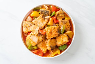 fish stew with tomato and pepper on plate