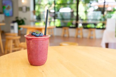 mixed berry smoothies in take away glass