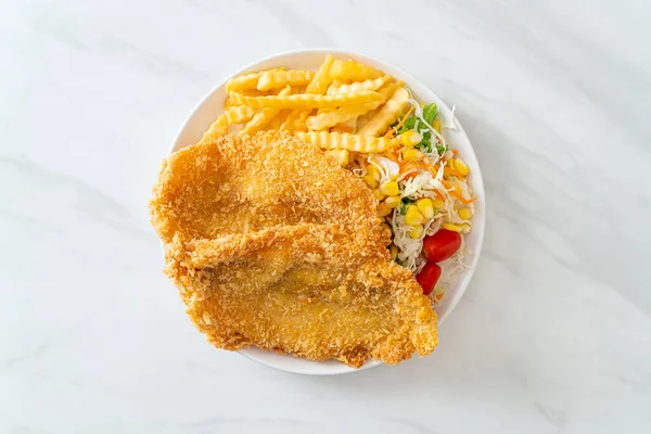 fish and chips with mini salad on white plate