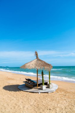 beach chair and umbrella with sea beach background - Holidays and vacation concept