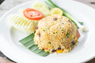 raisin fried rice on white plate