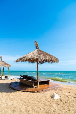 beach chair and umbrella with sea beach background - Holidays and vacation concept
