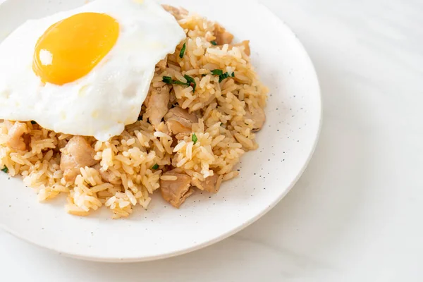 fried rice with pork and fried egg in Japanese style - Asian food style