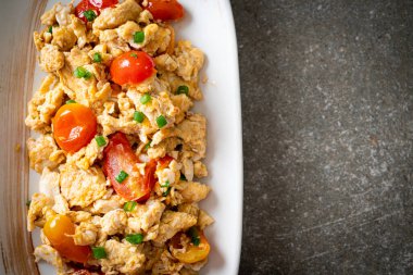 stir-fried tomatoes with egg on plate - healthy food style