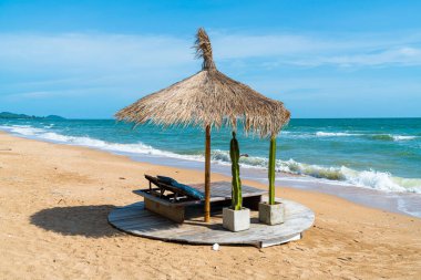 beach chair and umbrella with sea beach background - Holidays and vacation concept
