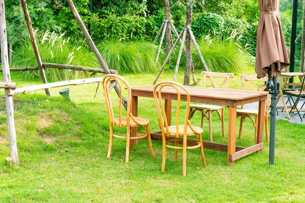 empty wood table and chair in garden