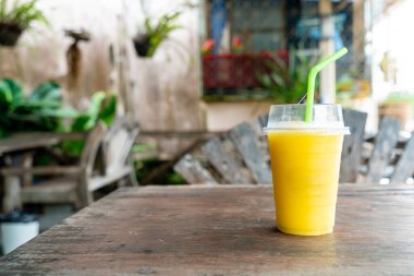 mango smoothies in plastic take away glass