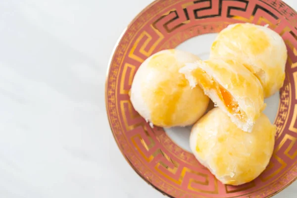 Chinese pastry moon cake with salted egg peanut or Spring Roll pastry with nuts and salted eggs - Asian food style