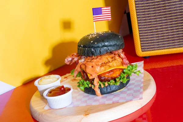 barbecue burger - pork with barbecue sauce with cheese, onion rings and bacon burger - American food style
