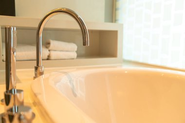 close-up tap on bath tub in bathroom
