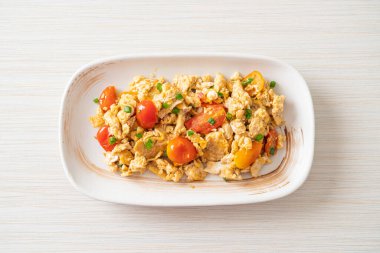 stir-fried tomatoes with egg on plate - healthy food style