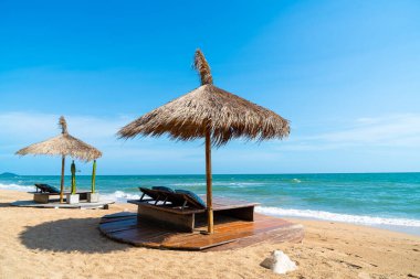 beach chair and umbrella with sea beach background - Holidays and vacation concept