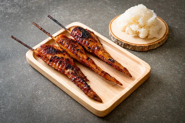 grilled or barbecue chicken wings skewer with sticky rice