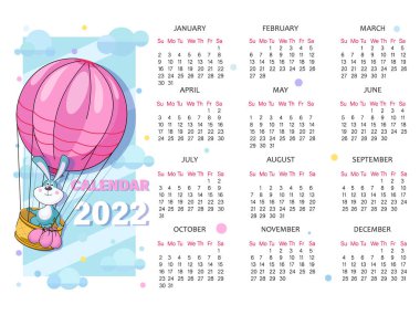 Takvim 2022. Balon. Hava yolculuğu. Balon sepetindeki komik tavşan. Amblem. Çocuk takvimi