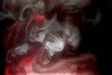 Kırmızı siyah pigment dönen mürekkep soyut arkaplan, suyun altında sıvı duman boyası