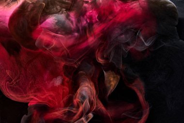 Kırmızı siyah pigment dönen mürekkep soyut arkaplan, suyun altında sıvı duman boyası