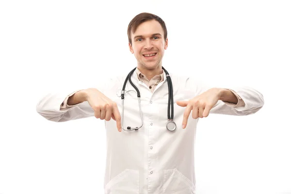 Handsome Doctor White Medical Coat Stethoscope Points Finger Empty Space — Stock Photo, Image
