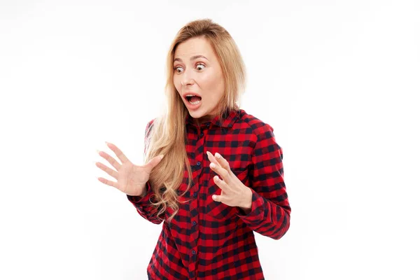 Shocked Blond Girl Looks Surprised Spreads Her Arms White Studio — Stock Photo, Image