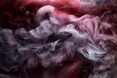Black and red ink background, colorful fog, abstract swirling ocean, acrylic paint pigment underwater, white smoke clipart
