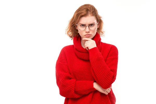 Smart Redhead Girl Red Glasses Holding Chin Thinks Doubts Makes — стоковое фото