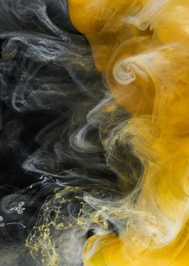 Sıvı akışkan sanat özgeçmişi. Siyah, sarı dans eden akrilik boyalar suyun altında, uzay dumanı okyanusu