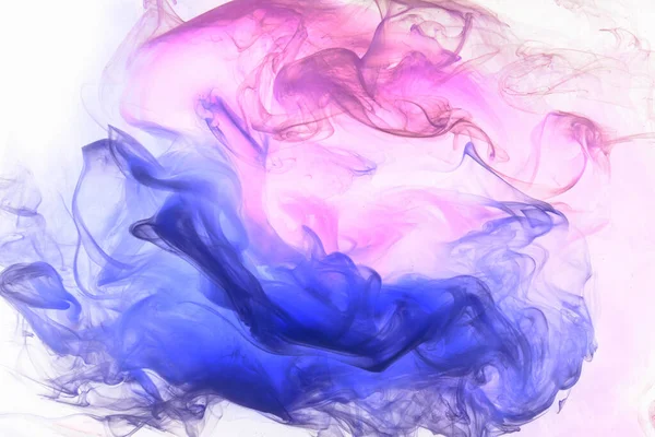 Liquid fluid art abstract background. Pink blue acrylic paint underwater, galactic smoke ocean