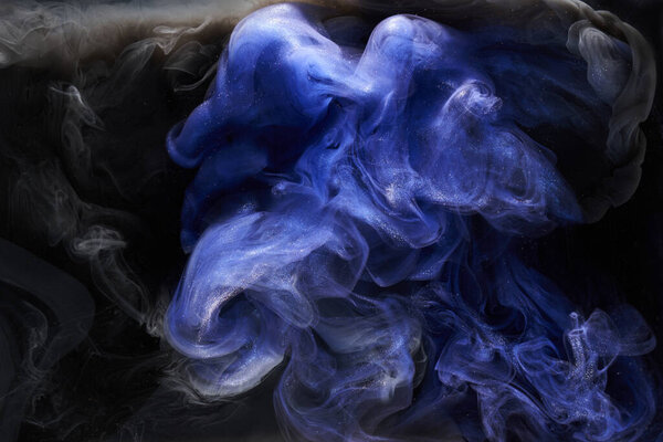 Liquid fluid art abstract background. Black blue acrylic paint underwater, galactic smoke ocean