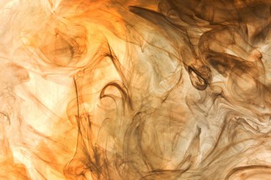 Sıvı akışkan sanat özgeçmişi. Ocher jetleri ve duman halkaları dans eden akrilik boyalar su altında, uzay okyanusu, renk patlaması