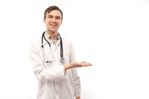 Handsome Doctor White Medical Coat Stethoscope Holding Something Isolated White — Stock Photo, Image